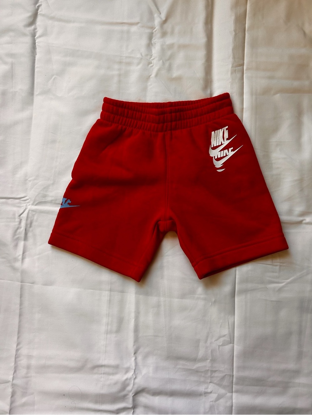 Nike Red Kids Shorts with White and Light Blue Logos